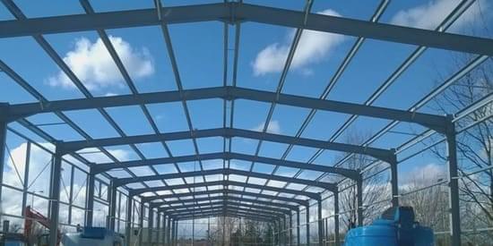 Steel portal frames are commonly used to construct industrial units. "Steel portal frames are commonly used to construct industrial units."